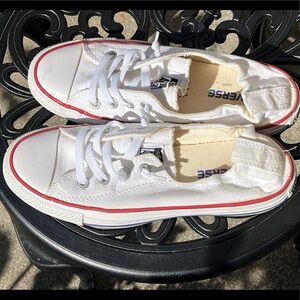 Lady’s white *All Star* Converse
